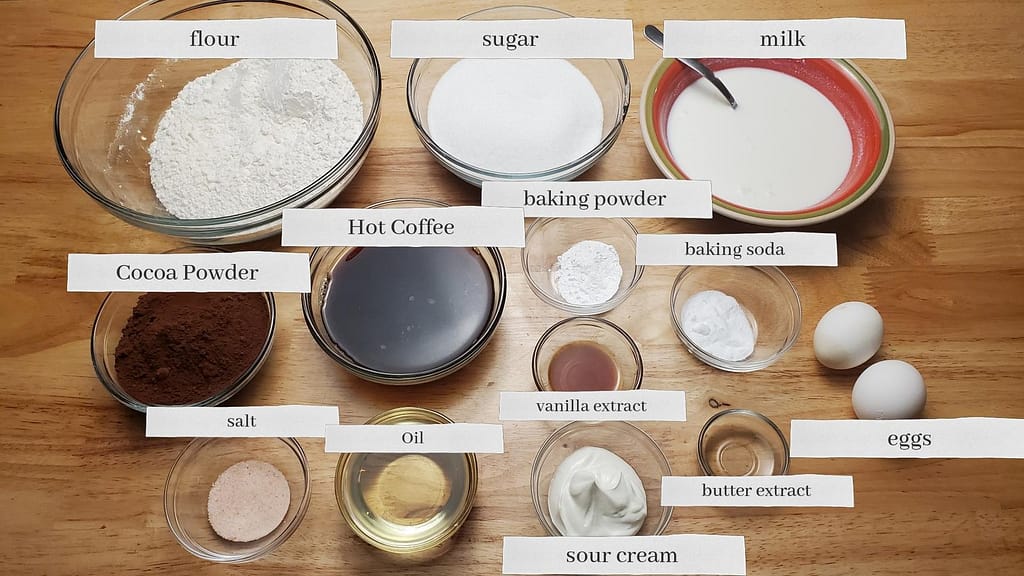 This image shows almost all the ingredients needed to make the moist fudge chocolate cake as described by this blog post on lesliecooks.com