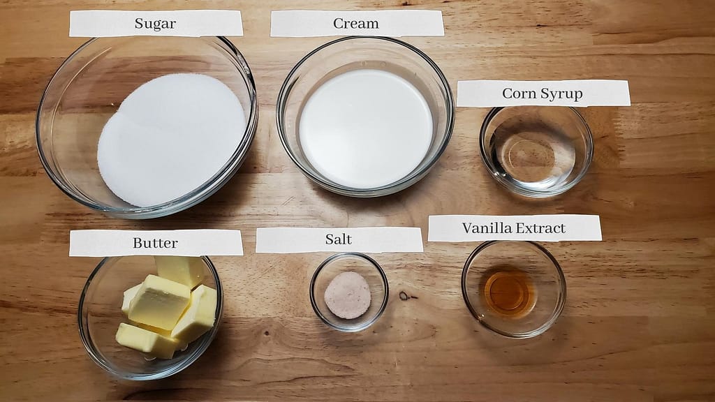 This image shows the ingredients for caramel sauce. From left to right: Sugar, cream, corn syrup, butter, salt, and vanilla extract.