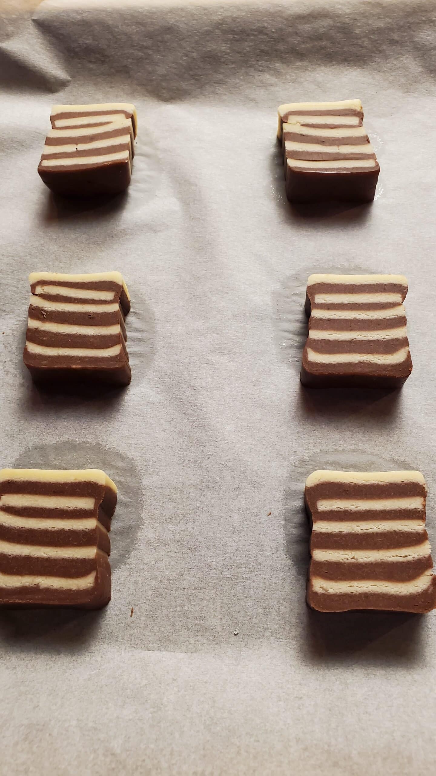 This image depicts stripped slice and back cookies. Following the recipe on this blog page allows for the creation of these types of cookie designs.