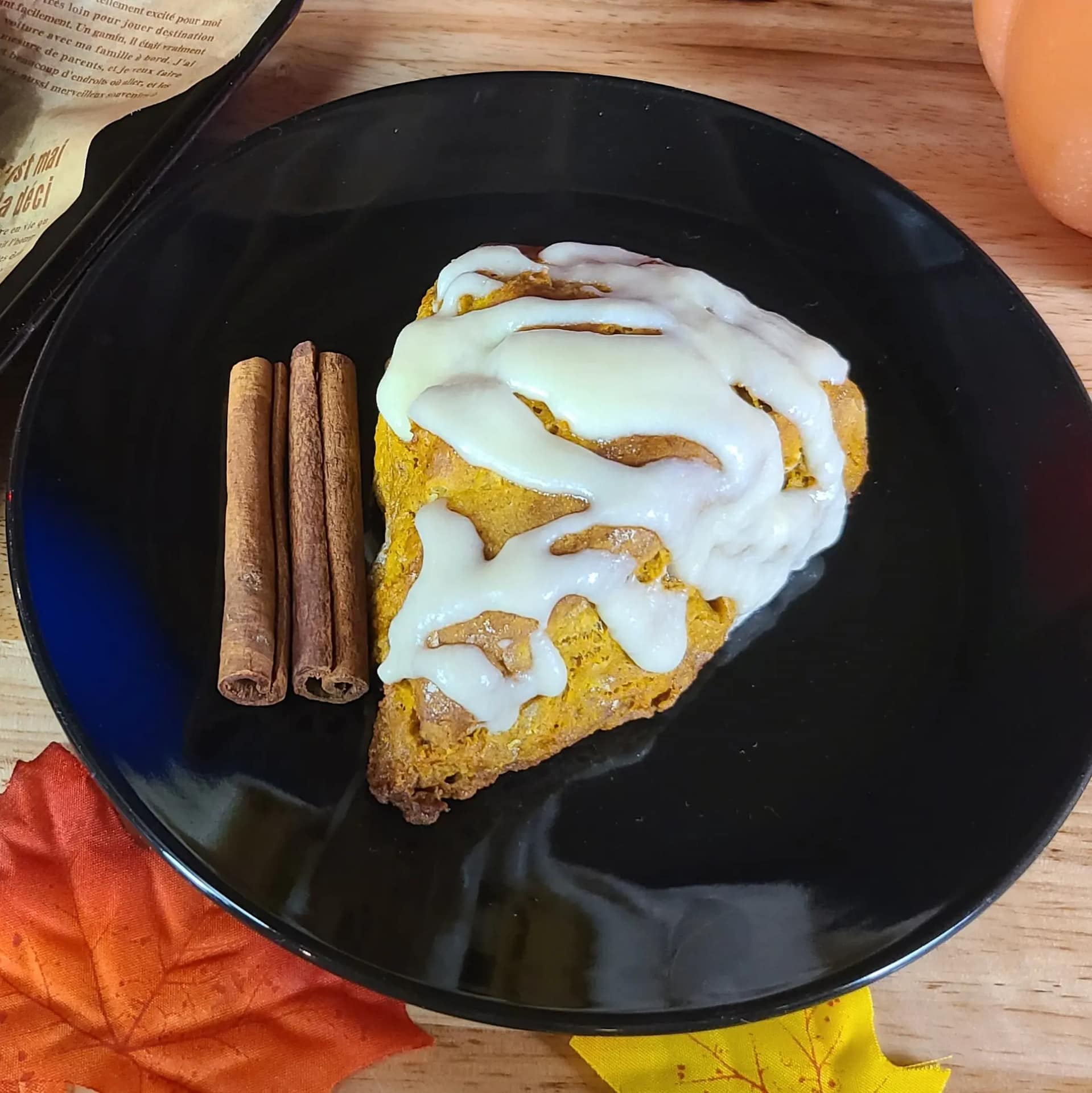 This image depicts a glazed pumpkin scone as described by this recipe on this blog post.