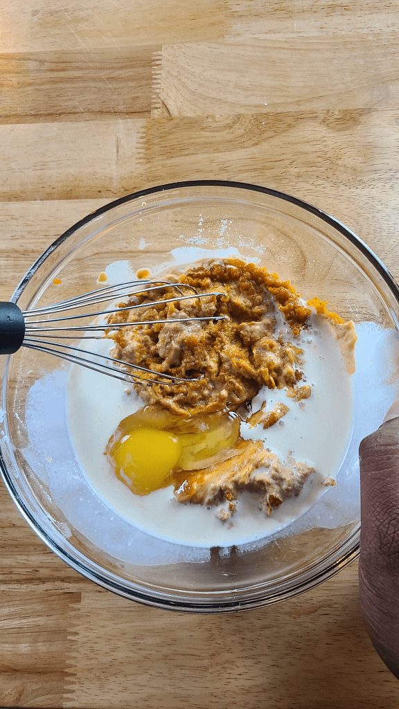 This image shows the mixing of the wet ingredients fpr making pumpkin scones as described by this blog post on lesliecooks.com.