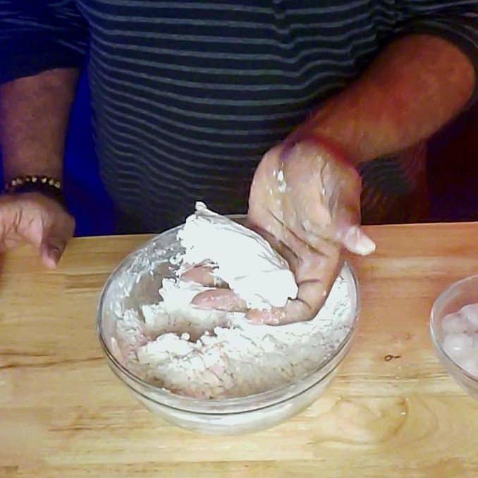 This picture depicts the squeeze test to determine if there is enough moisture in the pie crust This is to show how to prevent mistakes with making pie crust.