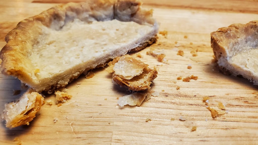 Flaky pie crust 6- Leslie Cooks This image depicts cooked pie crust that shows how flaky of a crust this recipe will create.