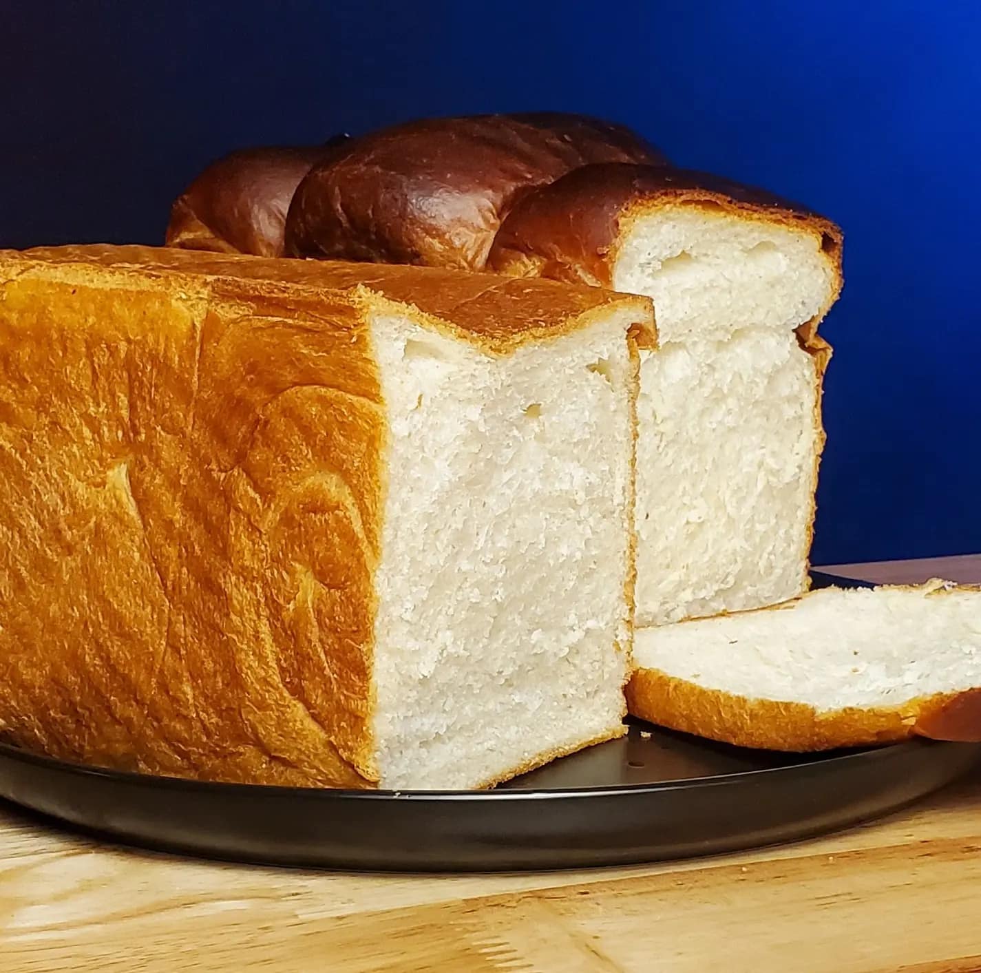 Milk Bread3 - Leslie Cooks This is an image of milk bread. It is depicting a square loaf and a regular loaf of milk bread.