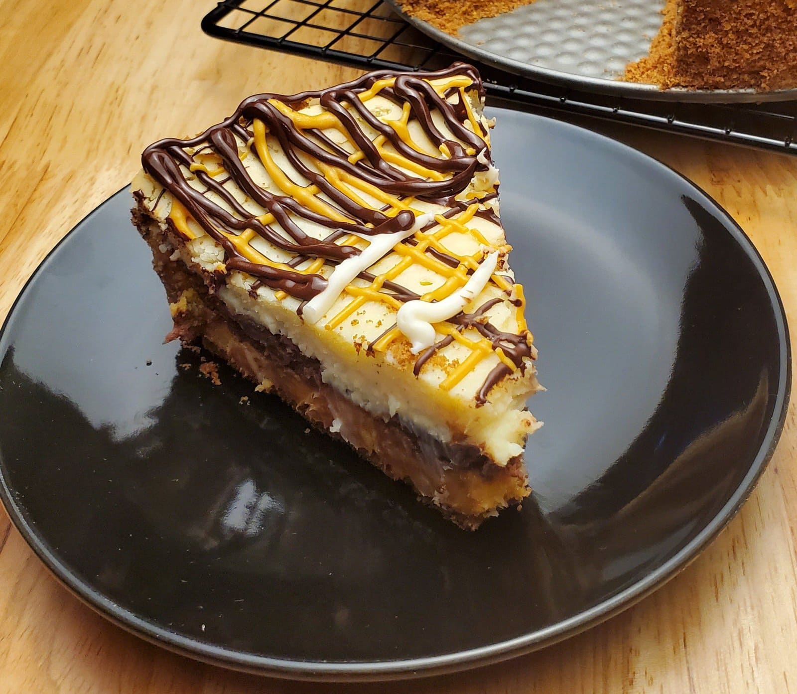 Chocolate Deluxe Cheesecake - Leslie Cooks. This image depicts a slice of the cheesecake described in this blog post.