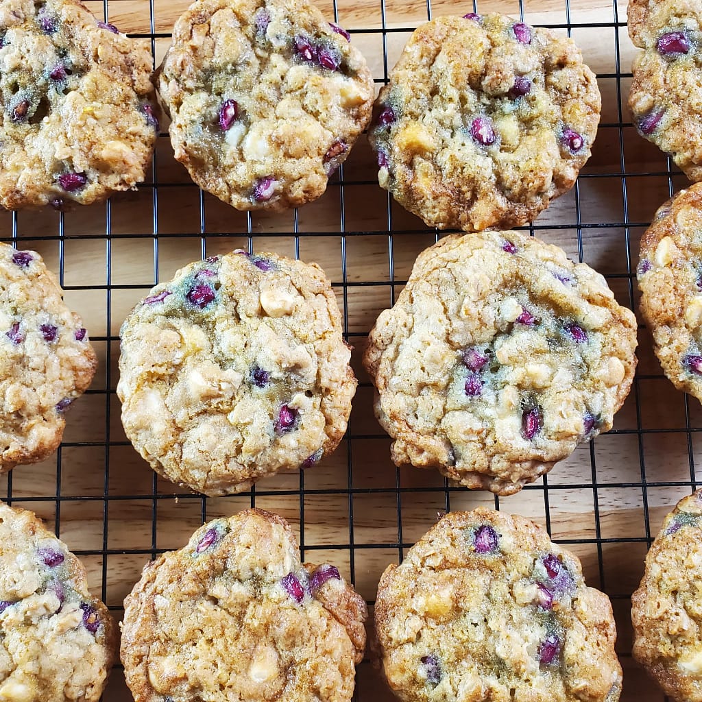 This image depicts baked pomegranate cookies cooling on a wire rack. This is what the cookies look like if you follow the detailed recipe on lesliecooks.com.