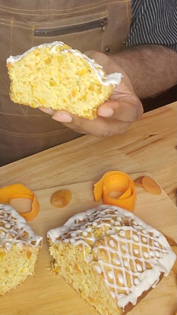 This image depicts a slice of apricot carrot bread as described by this blog post on lesliecooks.com