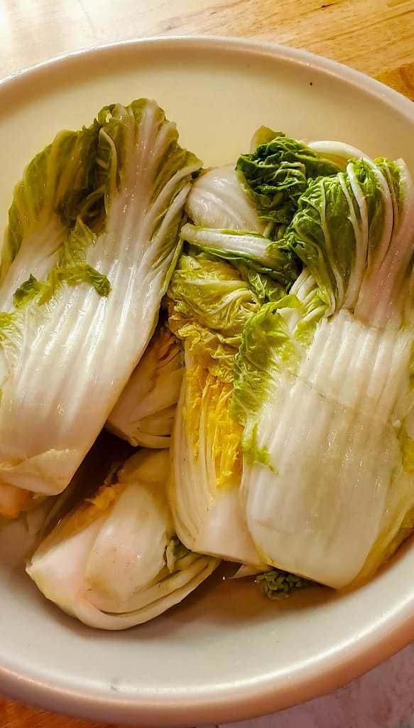 This image depicts Napa cabbage that has been salted in order to turn it into Korean Kimchi.