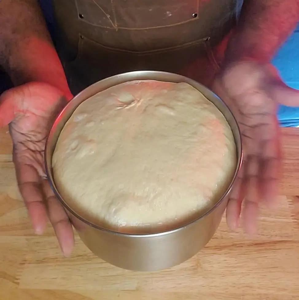 This image depicts well proofed yeast dough using to make the Always soft cinnamon rolls featured on lesliecooks.com